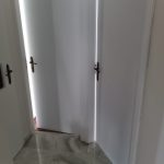 hallway with three room doors