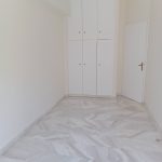 room with ceramic floor, closet, and bright balcony light
